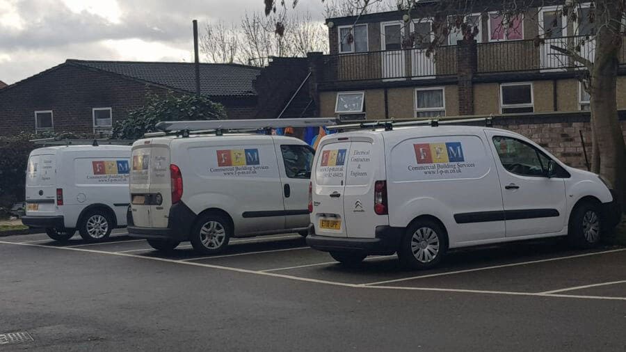 3 of our fleet vehicles parked side by side whilst working on a community project.