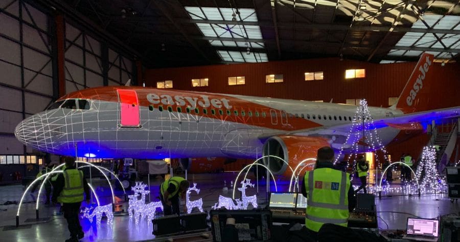 Easyjet Airbus A320 digitally mapped for a light show projected onto the plane and throughout the hanger.